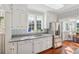 Clean kitchen design with stainless steel appliances, wood floors, and modern fixtures at 890 W Wesley Nw Rd, Atlanta, GA 30327