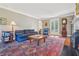 Cozy living room with fireplace, hardwood floors, and access to the outdoors at 890 W Wesley Nw Rd, Atlanta, GA 30327