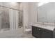 Neutral bathroom features shower over tub, vanity with marble countertop, and stylish fixtures at 1200 Ponce De Leon Ne Ave # A-19, Atlanta, GA 30306