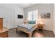 Clean bedroom features wood floors, double closets, and TV for modern convenience at 1200 Ponce De Leon Ne Ave # A-19, Atlanta, GA 30306