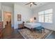 Bright bedroom with hardwood floors, neutral decor, and a large window providing natural light at 1200 Ponce De Leon Ne Ave # A-19, Atlanta, GA 30306
