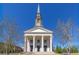 Stunning building featuring white columns, a steeple, and symmetrical architectural design at 1200 Ponce De Leon Ne Ave # A-19, Atlanta, GA 30306