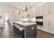 Modern kitchen featuring an island with seating, stainless steel appliances, and ample cabinet space at 1200 Ponce De Leon Ne Ave # A-19, Atlanta, GA 30306