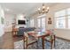 Open-concept living room and dining area with hardwood floors, fireplace, and lots of natural light at 1200 Ponce De Leon Ne Ave # A-19, Atlanta, GA 30306