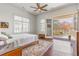 Bright main bedroom with hardwood flooring and large glass doors leading to private balcony at 1200 Ponce De Leon Ne Ave # A-19, Atlanta, GA 30306