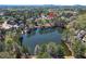 Breathtaking aerial view of a home nestled by a serene lake and lush greenery at 3185 Casteel Ne Rd, Marietta, GA 30062