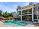 Beautiful backyard with a sparkling pool, hot tub, screened porch, and lush landscaping at 3185 Casteel Ne Rd, Marietta, GA 30062