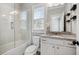Modern bathroom featuring a glass shower, tile flooring, and granite countertop vanity at 3185 Casteel Ne Rd, Marietta, GA 30062