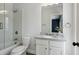 Clean bathroom with shower, tub, white subway tile and updated vanity at 3185 Casteel Ne Rd, Marietta, GA 30062
