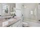 Bathroom featuring granite countertop, white cabinets, and a glass-enclosed shower at 3185 Casteel Ne Rd, Marietta, GA 30062