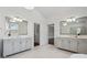 Luxury bathroom with dual vanities, tile flooring, and modern fixtures at 3185 Casteel Ne Rd, Marietta, GA 30062