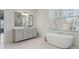 Bathroom vanity features granite countertop, bathtub and large mirror at 3185 Casteel Ne Rd, Marietta, GA 30062