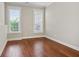 Bedroom features hardwood floors and two windows at 3185 Casteel Ne Rd, Marietta, GA 30062