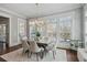 Bright dining room with ample windows, modern lighting, and stylish decor at 3185 Casteel Ne Rd, Marietta, GA 30062