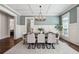 Dining room featuring wainscoting, coffered ceiling, modern chandelier, and hardwood floors at 3185 Casteel Ne Rd, Marietta, GA 30062