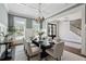 Dining room with stylish decor, coffered ceiling, chandelier, and hardwood floors at 3185 Casteel Ne Rd, Marietta, GA 30062