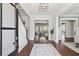 Elegant foyer with hardwood floors, staircase, and open sightlines to other rooms at 3185 Casteel Ne Rd, Marietta, GA 30062