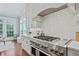 Gourmet kitchen featuring a stainless steel range, white cabinets, and granite countertops at 3185 Casteel Ne Rd, Marietta, GA 30062