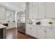 Spacious kitchen featuring stainless steel refrigerator, white cabinetry, and granite countertops at 3185 Casteel Ne Rd, Marietta, GA 30062