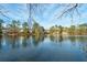 Scenic view of the lake showcasing waterfront properties and lush greenery at 3185 Casteel Ne Rd, Marietta, GA 30062