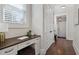 Hallway built-in desk area with hardwood floors and closet space at 3185 Casteel Ne Rd, Marietta, GA 30062