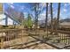 Spacious wooden back deck featuring wooden railings and an outdoor seating area at 3242 Monarch Pine Nw Dr, Peachtree Corners, GA 30071