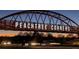 The pedestrian bridge spanning Peachtree Corners Parkway, illuminated by the city's name, marks an architectural highlight at 3242 Monarch Pine Nw Dr, Peachtree Corners, GA 30071