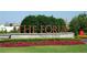 The Forum retail sign on Peachtree Parkway is enhanced by manicured landscaping and seasonal flowers at 3242 Monarch Pine Nw Dr, Peachtree Corners, GA 30071