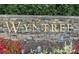 Stone monument sign reading 'Wyntree' in gold lettering, adding a touch of elegance to the community's entrance at 3242 Monarch Pine Nw Dr, Peachtree Corners, GA 30071