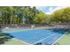 Tennis courts with a blue playing surface, set within the Wyntree community at 3242 Monarch Pine Nw Dr, Peachtree Corners, GA 30071