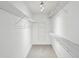 Organized walk-in closet featuring multiple wire shelves and ample storage space at 3242 Monarch Pine Nw Dr, Peachtree Corners, GA 30071