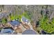 Aerial view of home with mature landscaping and nearby neighborhood properties at 535 Cameron Manor Way, Atlanta, GA 30328