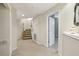 Finished basement entrance with carpeted stairs, and a doorway, providing additional living space at 535 Cameron Manor Way, Atlanta, GA 30328