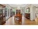 Elegant dining room features hardwood floors, chandelier, and large windows overlooking the landscaped yard at 535 Cameron Manor Way, Atlanta, GA 30328