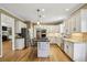 Updated kitchen featuring stainless steel appliances, white cabinetry, and a central island at 535 Cameron Manor Way, Atlanta, GA 30328