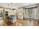 Spacious kitchen featuring an island with barstool seating and natural light at 535 Cameron Manor Way, Atlanta, GA 30328
