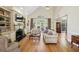 Comfortable living room featuring a fireplace with built-in shelving and hardwood floors at 535 Cameron Manor Way, Atlanta, GA 30328