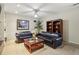 Finished basement living area with neutral walls, ceiling fan, and comfortable seating for relaxation and entertainment at 535 Cameron Manor Way, Atlanta, GA 30328