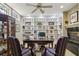 Bright home office featuring custom built-ins, a desk, and a cozy fireplace, creating an inviting workspace at 535 Cameron Manor Way, Atlanta, GA 30328