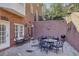 Charming outdoor patio with stone flooring, surrounded by brick walls and lush greenery, perfect for entertaining at 535 Cameron Manor Way, Atlanta, GA 30328