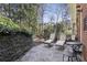 Outdoor patio area with lounge chairs and stone flooring, a tranquil space for relaxation and enjoyment at 535 Cameron Manor Way, Atlanta, GA 30328