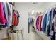 Walk-in closet with shelves and rods with a collection of clothes and storage, maximizing organization and storage at 535 Cameron Manor Way, Atlanta, GA 30328