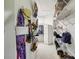 A walk-in closet has organized shelves with rods and storage, making it well-organized and maximizes the functionality at 535 Cameron Manor Way, Atlanta, GA 30328