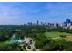 Aerial view of the community, lake, and surrounding city skyline at 1445 Monroe Ne Dr # G3, Atlanta, GA 30324