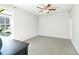 Well-lit bedroom featuring large windows, neutral carpet, and a ceiling fan at 1445 Monroe Ne Dr # G3, Atlanta, GA 30324
