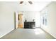 Spacious bedroom with a ceiling fan, neutral carpet, and plenty of natural light at 1445 Monroe Ne Dr # G3, Atlanta, GA 30324