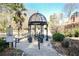 Ornamental gazebo with seating offers a tranquil spot in a landscaped communal space at 1445 Monroe Ne Dr # G3, Atlanta, GA 30324