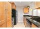 Bright kitchen featuring stainless steel appliances, granite counters, and tile flooring at 1445 Monroe Ne Dr # G3, Atlanta, GA 30324