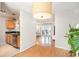 Open-concept layout with hardwood flooring flowing from the kitchen, through to the living area and balcony at 1445 Monroe Ne Dr # G3, Atlanta, GA 30324