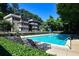 Inviting community pool surrounded by lounge chairs and lush greenery on a sunny day at 1445 Monroe Ne Dr # G3, Atlanta, GA 30324